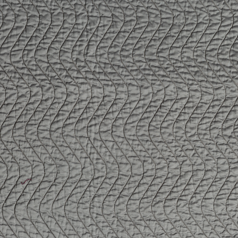 Cirillo Twin Coverlet | Moonlight | A close up of quilted cotton sateen fabric in moonlight, a saturated, cool, mid-dark grey tone.
