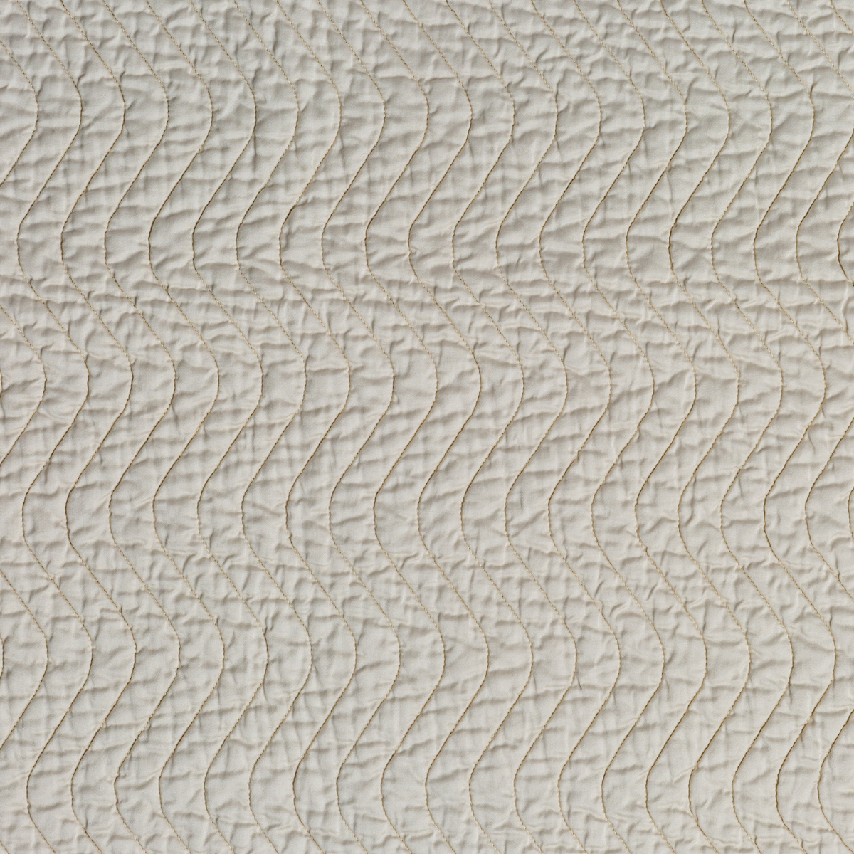 Cirillo Twin Coverlet | Parchment | A close up of quilted cotton sateen fabric in parchment, a warm, antiqued cream.