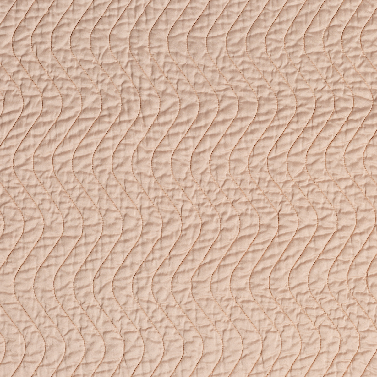 Cirillo Sham | Pearl | A close up of quilted cotton sateen fabric in pearl, a nude-like, soft rose pink tone.