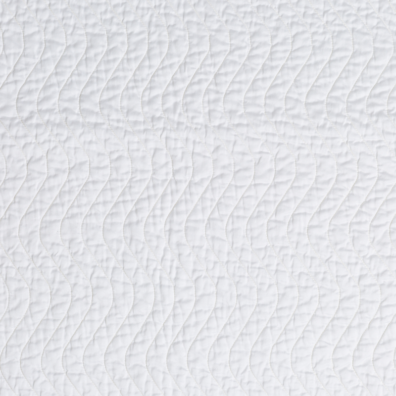 Cirillo Blanket | White | A close up of quilted cotton sateen fabric in classic white.