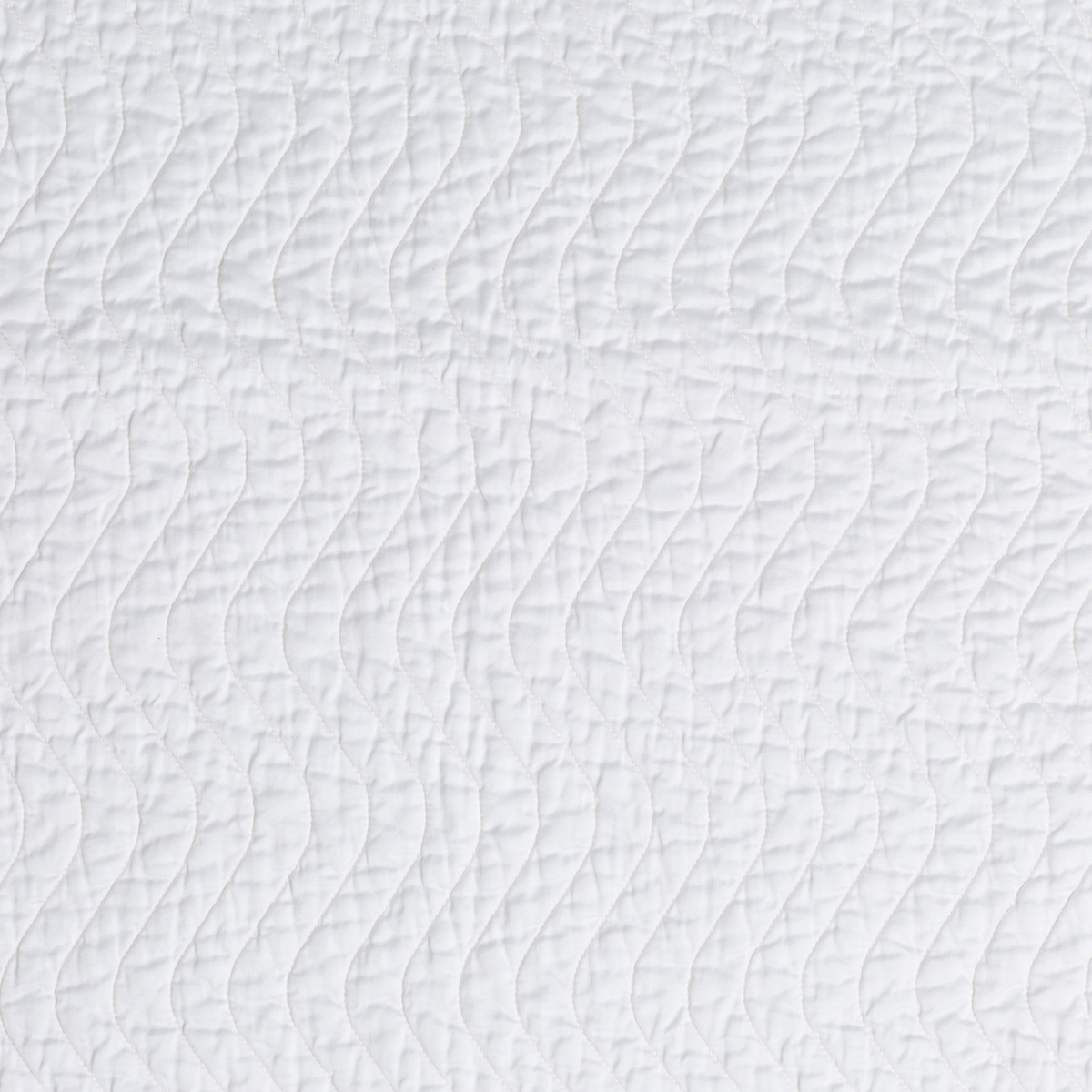 Cirillo Baby Blanket | White | A close up of quilted cotton sateen fabric in classic white.