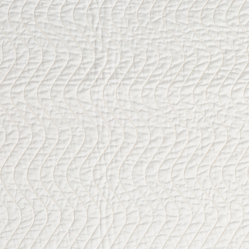 Cirillo Coverlet | Winter White | A close up of quilted cotton sateen fabric in winter white, softer and warmer in tone than classic white.