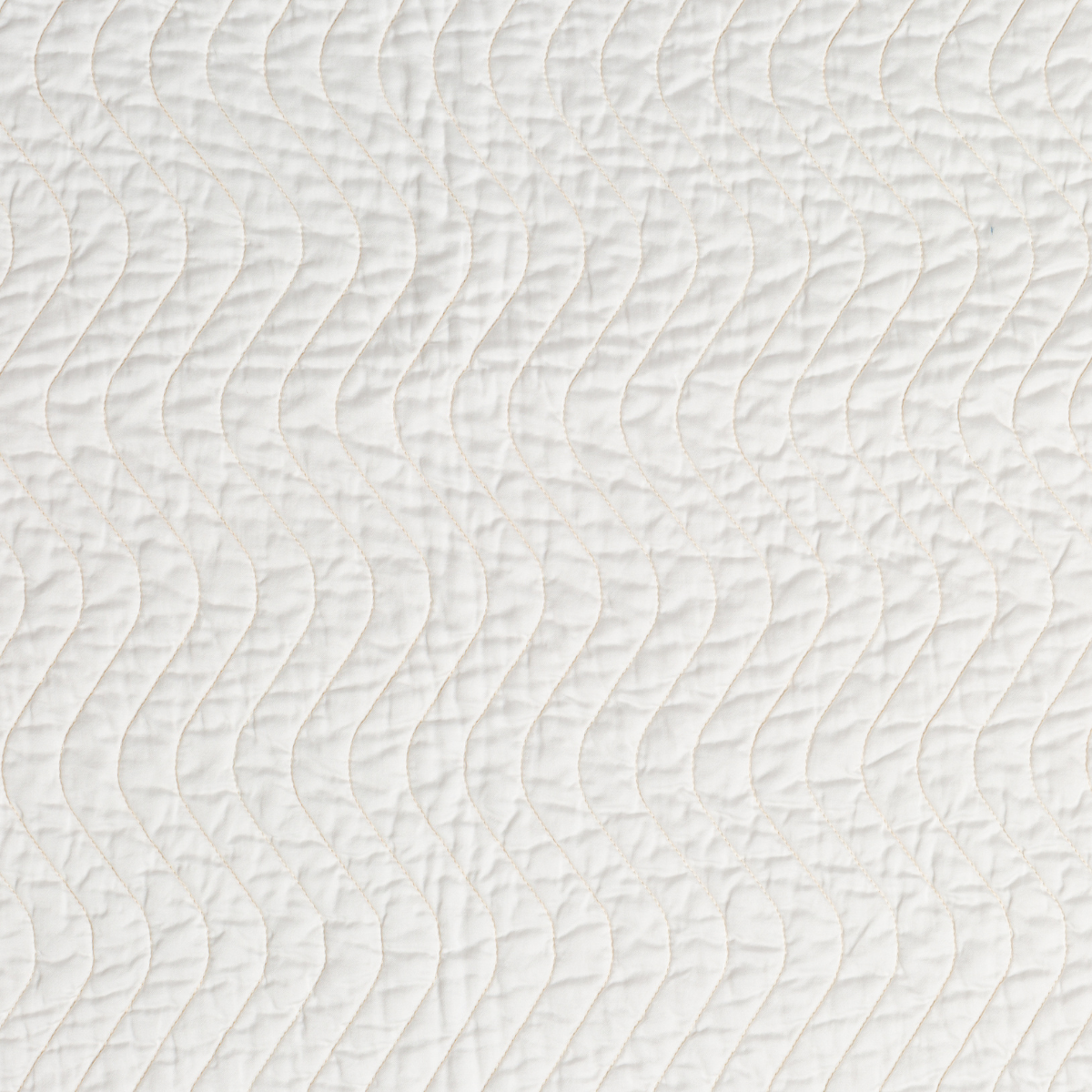 Cirillo Sham | Winter White | A close up of quilted cotton sateen fabric in winter white, softer and warmer in tone than classic white.