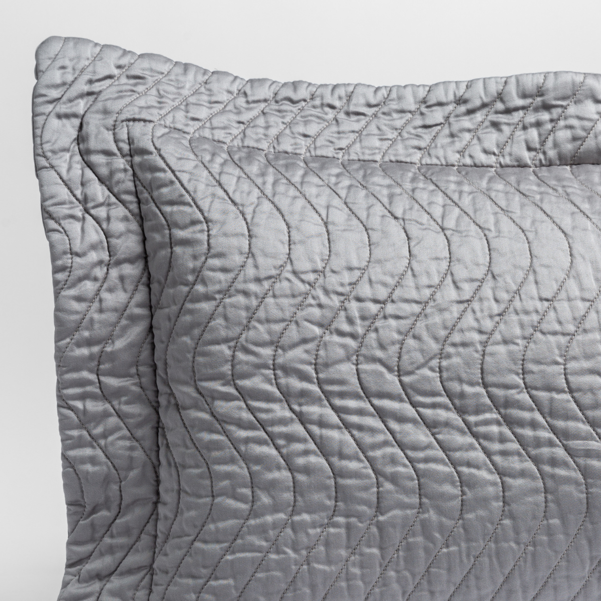 Cirillo Sham | Moonlight | close up of the corner of a quilted cotton sateen pillow sham - shot against a white background.