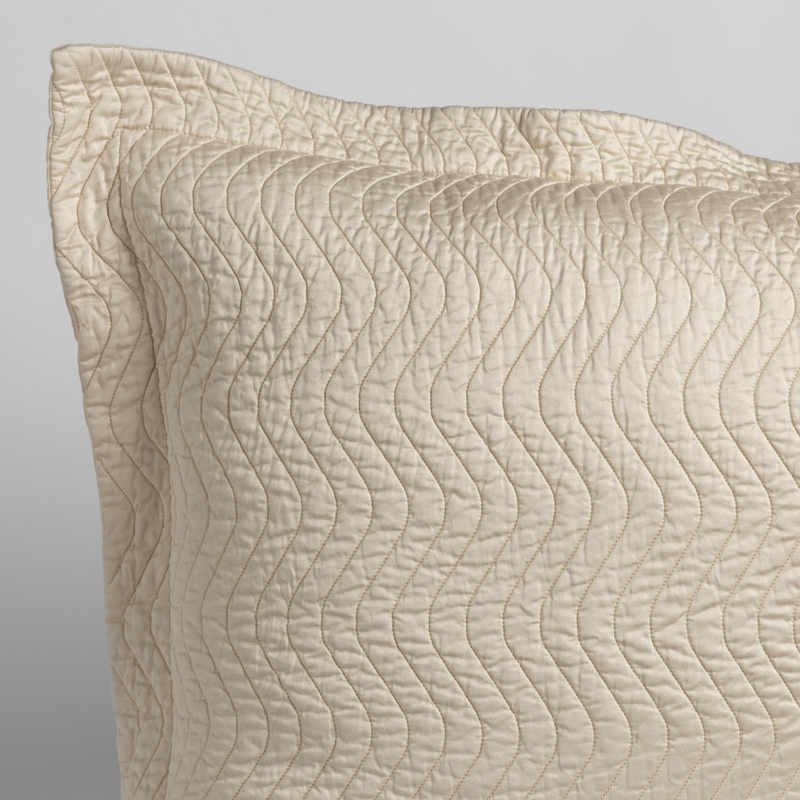 Cirillo Sham | Parchment | close up of the corner of a quilted cotton sateen pillow sham - shot against a white background.