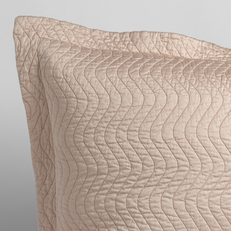 Cirillo Sham | Pearl | close up of the corner of a quilted cotton sateen pillow sham - shot against a white background.