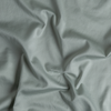 Cotton Sateen Yardage | Eucalyptus | A close up of cotton sateen fabric in eucalyptus, a soft light green.