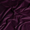 Harlow Crib Skirt | Fig | A close up of cotton velvet fabric in fig, a richly saturated purple-garnet.