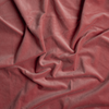 Harlow Blanket | Poppy | A close up of cotton velvet fabric in poppy, a warm coral pink.