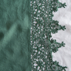 Frida Pillowcase (Single) | Jade | A close up of Frida, an antique cotton lace trim on a linen body, shown in jade, a rich, verdant green with subtle blue undertones.