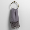Frida Guest Towel | French Lavender | lace trimmed linen guest towel draped through a decorative towel ring aginst a plain white background