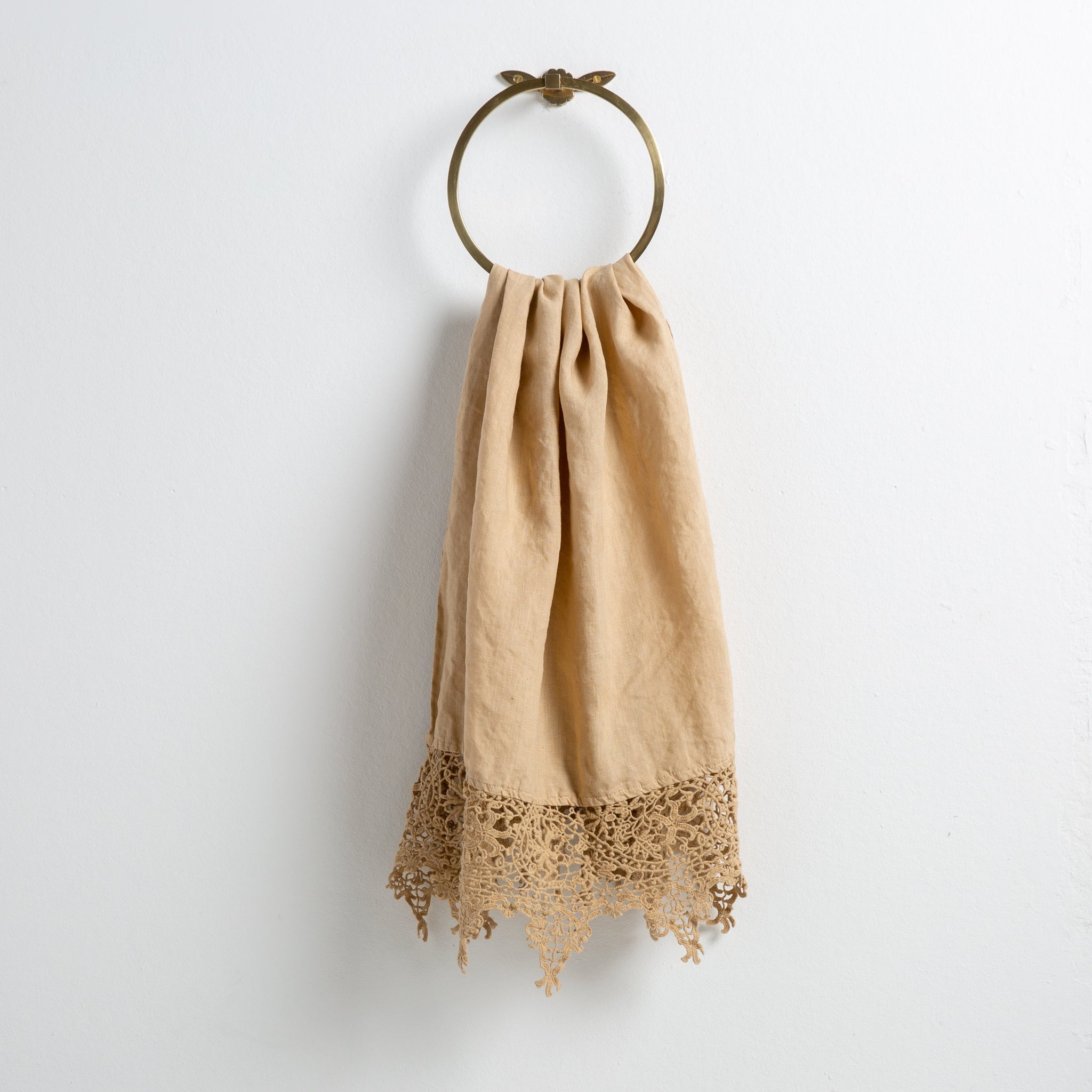 Frida Guest Towel | Honeycomb | Lace trimmed linen guest towel  draped through a decorative towel ring against a plain white background.