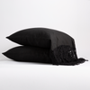 Frida Pillowcase (Single) | Corvino | two sleeping pillows stacked to show lace trimmed linen.