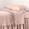 Linen Flat Sheet | Rouge | lace trimmed flat sheet shown with monochromatic bedding - side view.