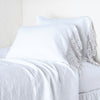 Linen Pillowcase (Single) | White | lace trimmed pillowcases shown with monochromatic bedding - side view.