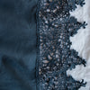 Frida Flat Sheet | Midnight | A close up of Frida, an antique cotton lace trim on a linen body, shown in midnight, a rich indigo tone.