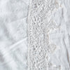 Frida Pillowcase (Single) | White | A close up of Frida, an antique cotton lace trim on a linen body, shown in white.