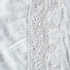 Frida Flat Sheet | White | A close up of Frida, an antique cotton lace trim on a linen body, shown in white.