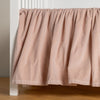 Harlow Crib Skirt | Pearl | cotton velvet crib skirt shown on a white crib .