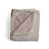 Harlow Blanket | Fog | overhead angle of the folded blanket with a corner pulled back to show the reverse and trim.