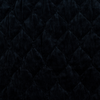 Harlow Swatch | Corvino | A close up of quilted cotton velvet fabric in Corvino, a black tone.