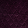 Harlow Twin Coverlet | Fig | A close up of quilted cotton velvet fabric in fig, a richly saturated purple-garnet.