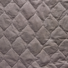 Harlow Swatch | Fog | A close up of quilted cotton velvet fabric in fog, a neutral-warm, soft mid-tone grey.