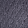Harlow Coverlet | French Lavender | a close up of quilted cotton velvet fabric in french lavender, a neutral violet tone.