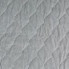 Harlow Twin Coverlet | Cloud | A close up of quilted cotton velvet fabric in cloud, a soft, subtle sky blue-grey.