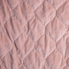 Harlow Coverlet | Rouge | A close up of quilted cotton velvet fabric in rouge, a mid-tone blush pink.