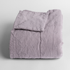 Ines Baby Blanket | French Lavender | embroidered midweight linen baby blanket folded and shown with the corner folded down to show the unembroidered linen back.