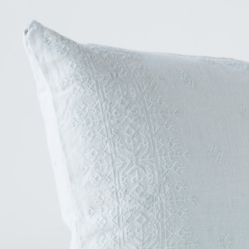 Ines Throw Pillow | Cloud | Close-up of pillow corner, showcasing the embroidery pattern detail.