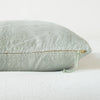 Eucalyptus | Close-up of brass zipper and charmeuse pull details in Eucalyptus Ines throw pillow - side view.