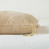 Ines Throw Pillow | Honeycomb | Close-up of brass zipper and charmeuse pull details on throw pillow - side view.