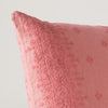 Ines Throw Pillow | Poppy | Close-up of pillow corner, showcasing the embroidery pattern detail.
