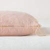 Ines Throw Pillow | Rouge | Close-up of brass zipper and charmeuse pull details on throw pillow - side view.