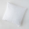 Ines Throw Pillow | White | pillow on a white background - overhead view.