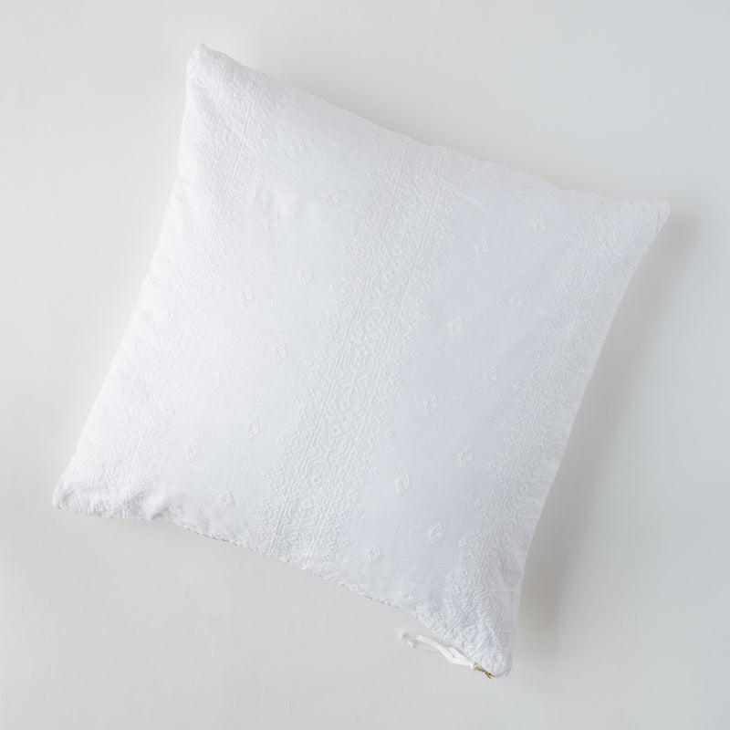Ines Throw Pillow | White | pillow on a white background - overhead view.