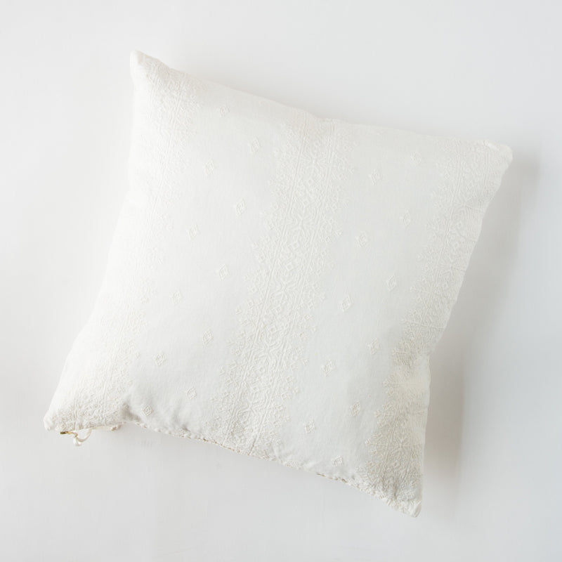 Ines Throw Pillow | Winter White | pillow on a white background - overhead view.