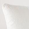 Ines Throw Pillow | Winter White | Close-up of pillow corner, showcasing the embroidery pattern detail.