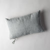 Ines Throw Pillow | Eucalyptus | embroidered midweight linen 15x24 pilow overhead on a white background.