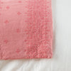 Ines Blanket | Poppy | Close-up of corner against a white background, showcasing embroidery pattern detail - overhead view.
