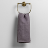 Ines Guest Towel | French Lavender | embroidered midweight linen guest towel hanging from a decorative towel ring.