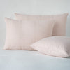 Ines Sham | Pearl | two shams leaning upright and one laying flat at an angle, against a white background.