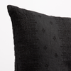 Ines Throw Pillow | Corvino | Close-up of pillow corner, showcasing the embroidery pattern detail.
