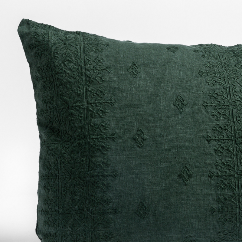 Ines Throw Pillow | Juniper | a close up of an embroidered midweight linen pillow cushion against a white background.