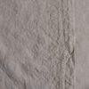 Ines Yardage with Vertical Bands | Fog | A close up of embroidered midweight linen fabric in fog, a neutral-warm, soft mid-tone grey.