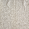 Ines Swatch Card | Parchment | A close up of embroidered midweight linen fabric in parchment, a warm, antiqued cream.