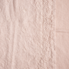 Ines Swatch | Pearl | A close up of embroidered midweight linen fabric in pearl, a nude-like, soft rose pink tone.