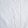 Ines Yardage with Vertical Bands | White | A close up of embroidered midweight linen fabric in classic white.